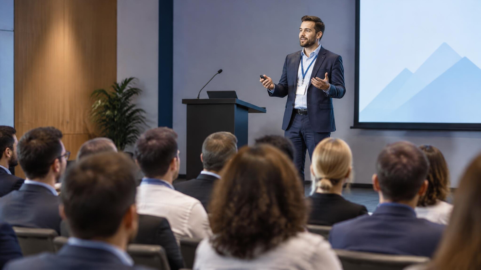 man speaking at conference