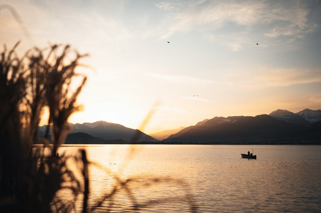 sunrise over calm water